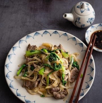 Vietnamese Stir Fry Rice Noodles with Beef (Pho Xao Thit Bo) is a delicious dish with tender and flavorful beef and soft rice noodles. Everything comes together in just 15-20 minutes! An excellent quick and easy dish!