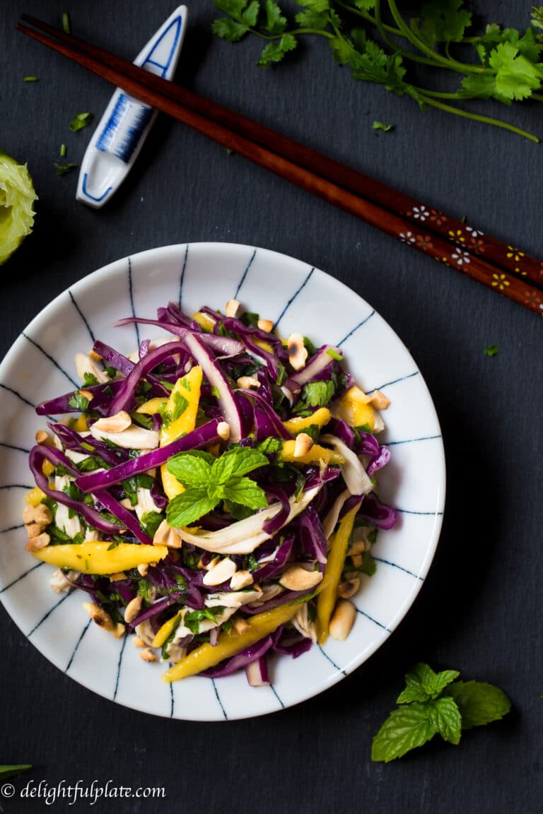 This cabbage-based salad with mango, shredded chicken and herbs is so refreshing and crunchy. It is also easy and quick to put together this salad.