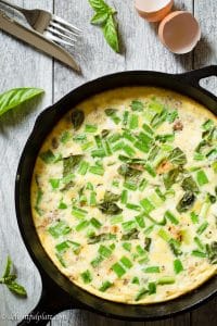 This luscious Vietnamese Frittata features eggs, ground pork, onion and basil. It's so quick and easy to make. You only need one cast iron skillet to cook it.