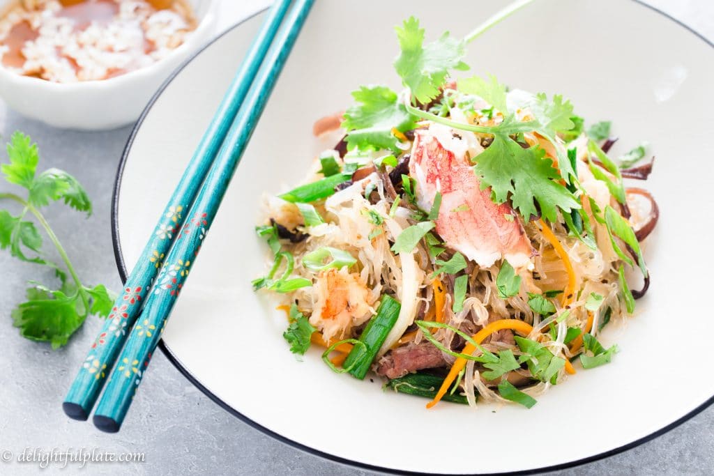 Crab Cellophane Noodles is a traditional Vietnamese dish. The dish is incredibly delicious with the natural sweetness of crab meat, soft translucent noodles, crunchy vegetables, and refreshing lime fish sauce dressing.
