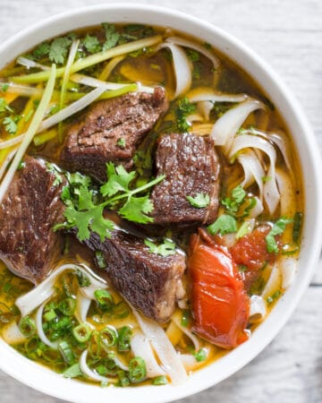 Vietnamese beef stew pho noodle soup (Pho bo sot vang) is a hearty and comforting noodle soup. This noodle soup features tender beef, flavorful broth and amazing aroma from pho spices.