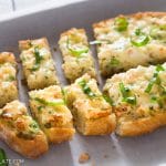 This baked shrimp toast features flavorful shrimp mixture on top of crispy bread. Sprinkle some fresh basil and serve as an appetizer for parties, holidays or any meals.