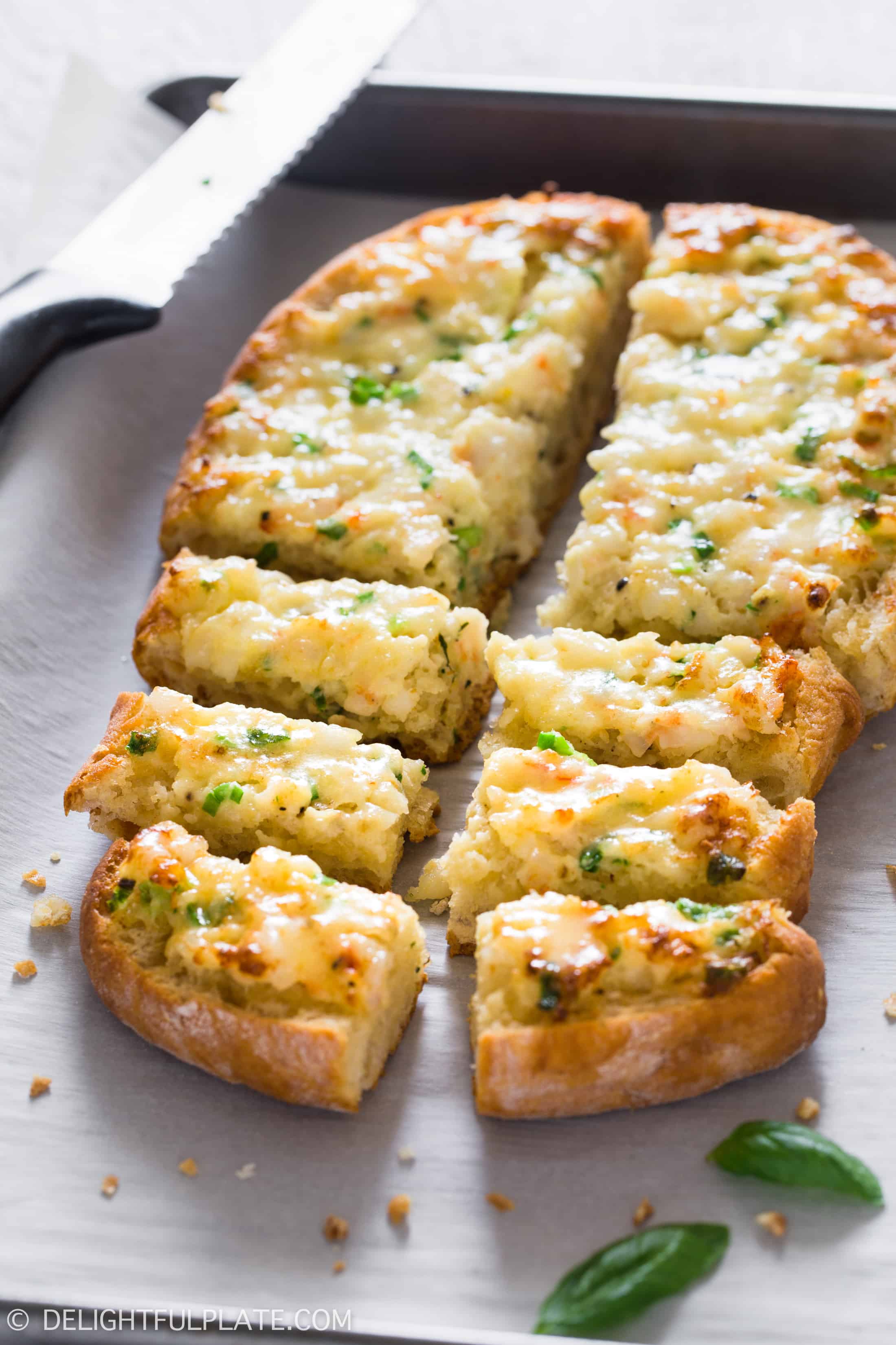 slices of baked shrimp toast on a baking sheet, a quick and easy appetizer for parties, holidays or any occasions.