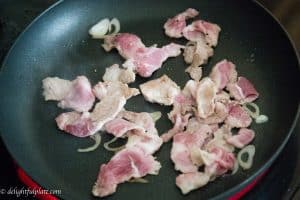 Cook pork for the filling of Vietnamese crepes (Banh Xeo)