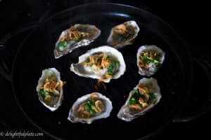 Vietnamese-style grilled oysters with scallion and fried shallot