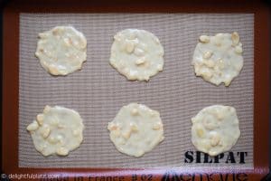 Baking almond tuile cookies on a baking mat