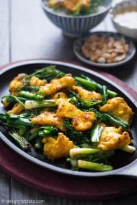 Vietnamese dill and turmeric fish with noodles (Cha Ca La Vong) is a delicious and iconic dish of Hanoi. Chunks of flavorful fish are plated on a bed of aromatic green scallions and dill, boosting a unique dining experience.