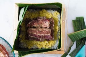 Assembling Banh Chung: add pork belly