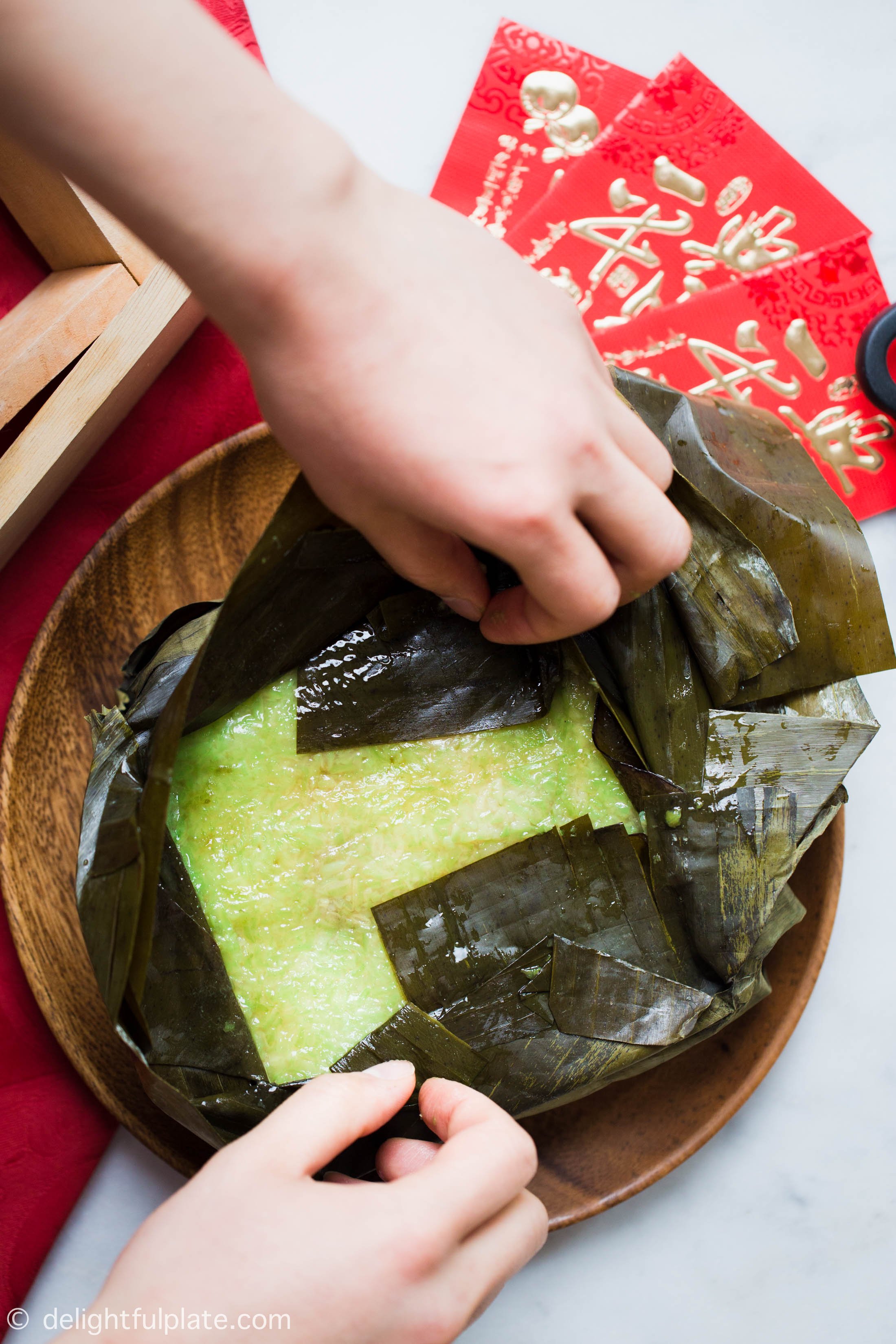 Vietnamese Square Sticky Rice Cake (Banh Chung) is a traditional cake for Lunar New Year celebration. The cake is so delicious with fragrant sticky rice, creamy mung bean filling and tender pork.