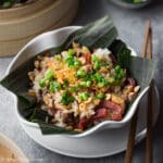 A delicious bowl of Vietnamese chicken sticky rice with Chinese sausage and shiitake mushrooms.