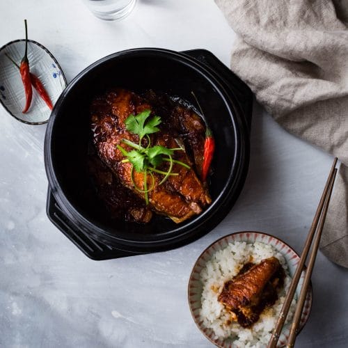 Vietnamese-style Caramelized Salmon is simmered with fish sauce and caramel sauce which gives it a delicious savory taste and beautiful color. Served with rice, this dish makes a very satisfying meal.