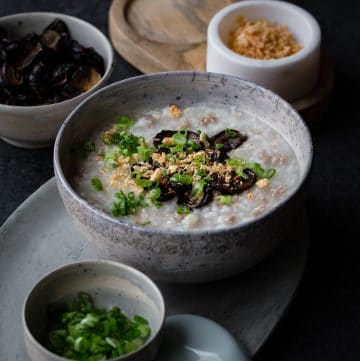 This Pressure Cooker Pork Congee with soy baked mushrooms is comforting and nourishing. Cooking the congee in a pressure cooker reduces time significantly while still achieving a creamy texture.
