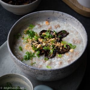 A hearty bowl of pork congee cooked in the pressure cooker and topped with soy baked mushroom.
