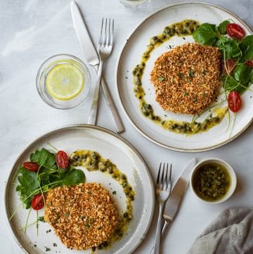 Crispy baked pork schnitzel that doesn't need to be deep-fried. It is healthy and much less messy to make. Serve it with a caper garlic butter sauce to increase the deliciousness.