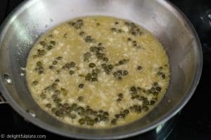 Simmer all ingredients to make caper garlic butter sauce