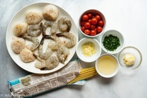 Ingredients for scallop shrimp pasta with burst cherry tomatoes