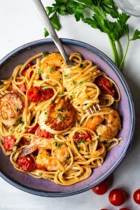 This scallop shrimp pasta with burst cherry tomatoes is perfect for not only quick and simple weeknight meals but also fancy date night dinners. It is so flavorful with sweetness from fresh seafood and umami from burst tomatoes.