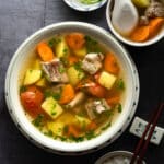 This Vietnamese Pork Rib Soup with Potatoes and Carrots (Canh Suon Khoai Tay Ca Rot) features tender pork ribs, potatoes, carrots with a clear and savory broth. Made with simple, easy to find and affordable ingredients.