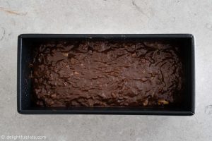 chocolate banana bread batter in a loaf pan
