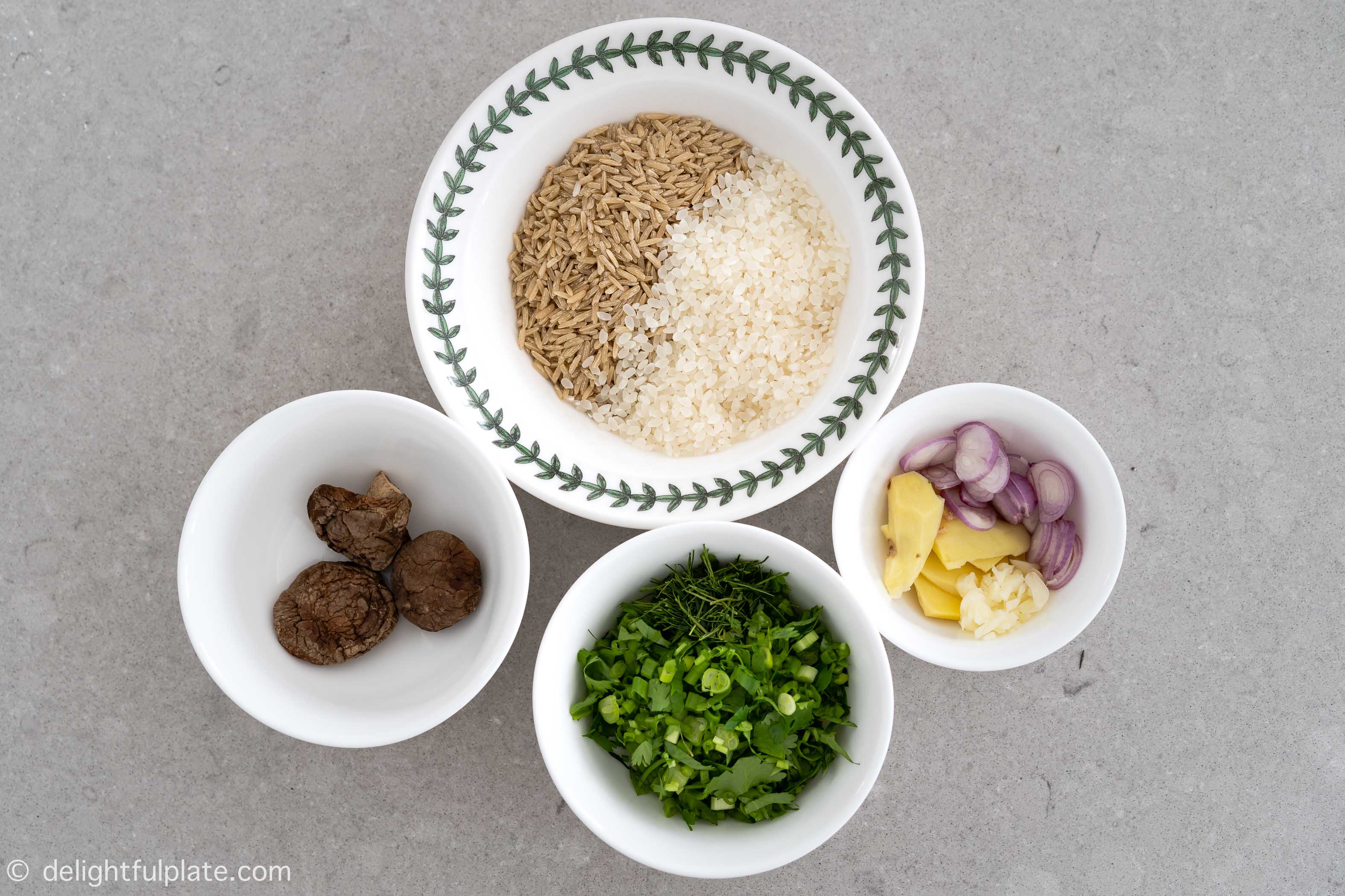 Rice, aromatics and herbs for chicken brown rice congee
