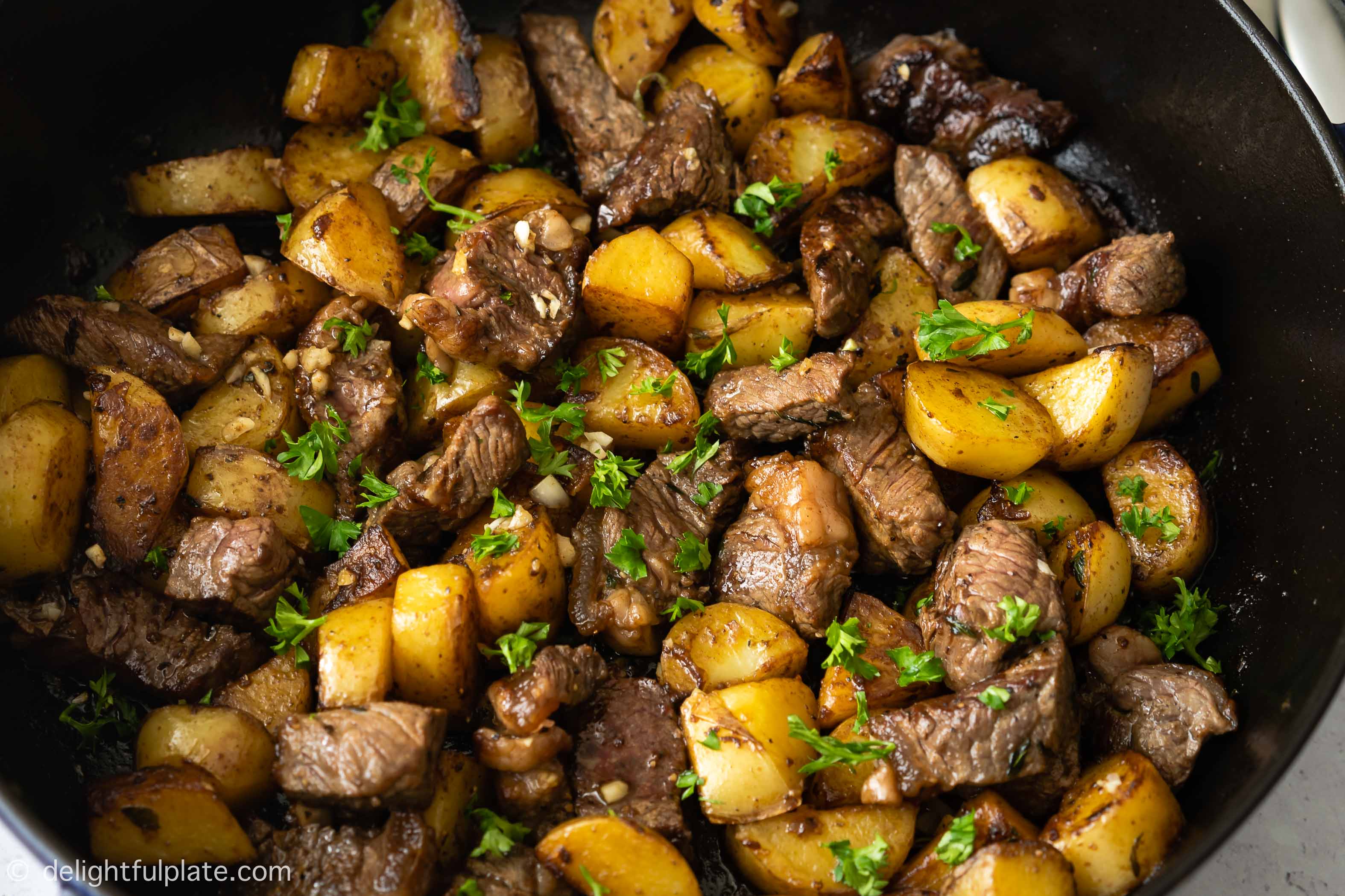 This Asian Steak Bites and Potatoes is an quick and easy one-pan weeknight dinner. It features beef cubes and tender potatoes with a buttery savory sauce.