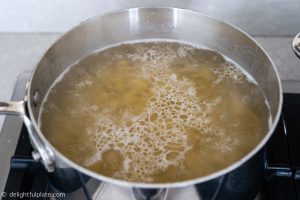 Cook pasta in boiling water