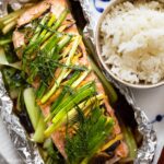 Asian Ginger Salmon in Foil with baby bok choy and aromatics and herbs.