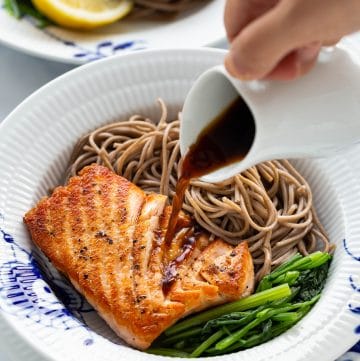 This Pan-Seared Salmon Soba Noodle Salad features moist medium-cooked salmon fillets with crispy skin over soba noodles and vegetables. Served with a ginger dressing, this delicious and healthy salad can be a full meal that is ready in under 30 minutes.﻿