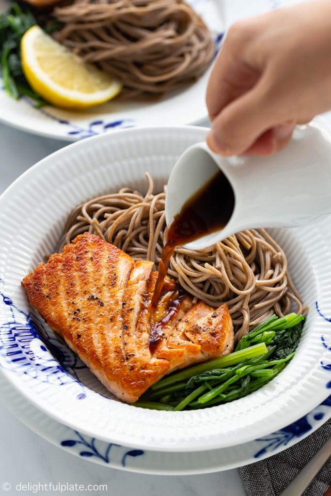 This Pan-Seared Salmon Soba Noodle Salad features moist medium-cooked salmon fillets with crispy skin over soba noodles and vegetables. Served with a ginger dressing, this delicious and healthy salad can be a full meal that is ready in under 30 minutes.﻿