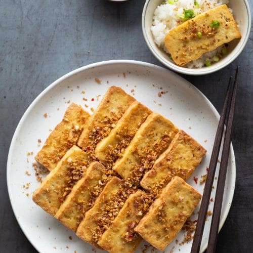 Vietnamese Lemongrass Chili Tofu (Dau Hu Chien Sa Ot) is a popular vegan Southern Vietnamese dish. Tofu is marinated with a lot of minced lemongrass and bird's eye chili before being fried until golden, crispy and fragrant.