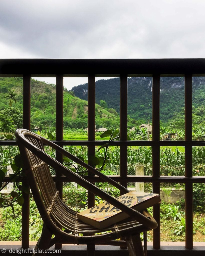 View of mountains, paddy fields and garden from the dining room at Xoi farmstay, Yen Bai