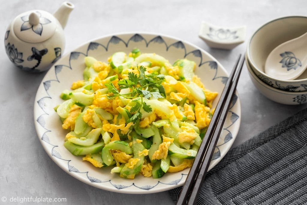 A plate of cucumber slices sautéed with garlic and eggs. Serve with rice.