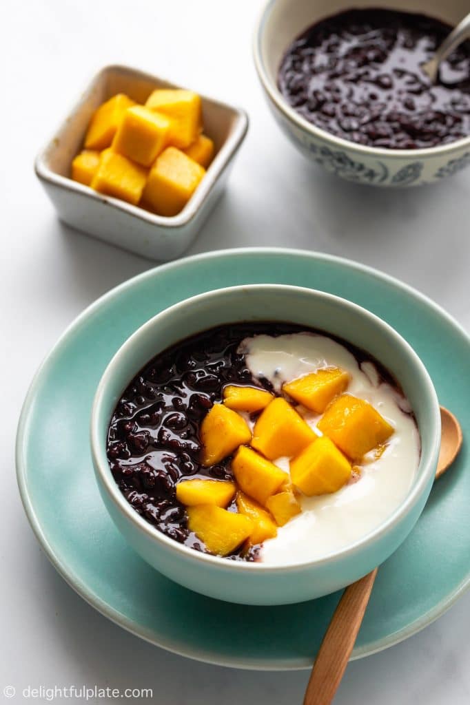 Black Sticky Rice Pudding served with yogurt and mango