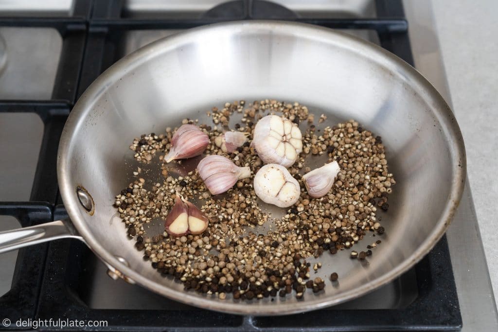 Toasting peppercorns and garlic bulbs