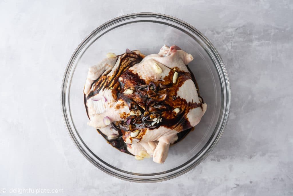 Marinate the duck legs with garlic, shallots, dark soy sauce for Vietnamese duck noodle soup