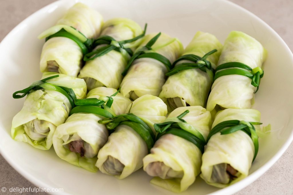 a plate with pork stuffed cabbage rolls