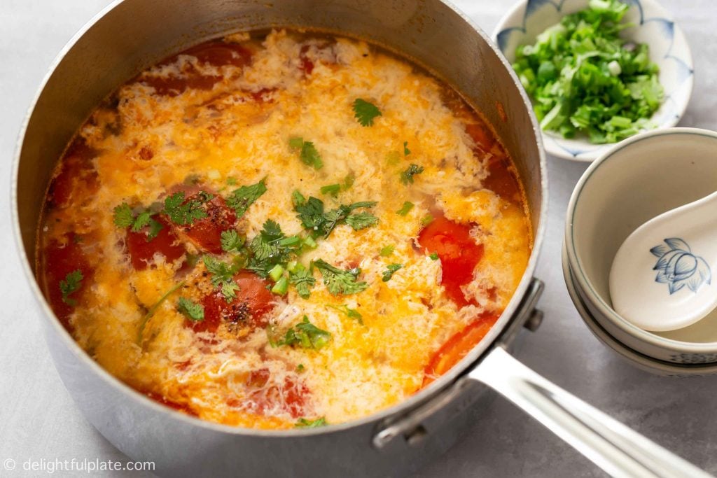 a pot of Vietnamese tomato egg drop soup