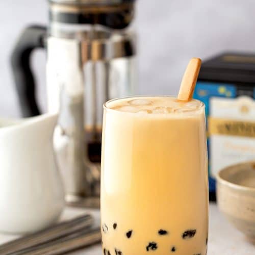 A glass of brown sugar milk tea with tapioca pearls
