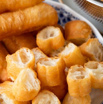 pieces of Chinese fried dough sticks (crullers) on a serving plate.