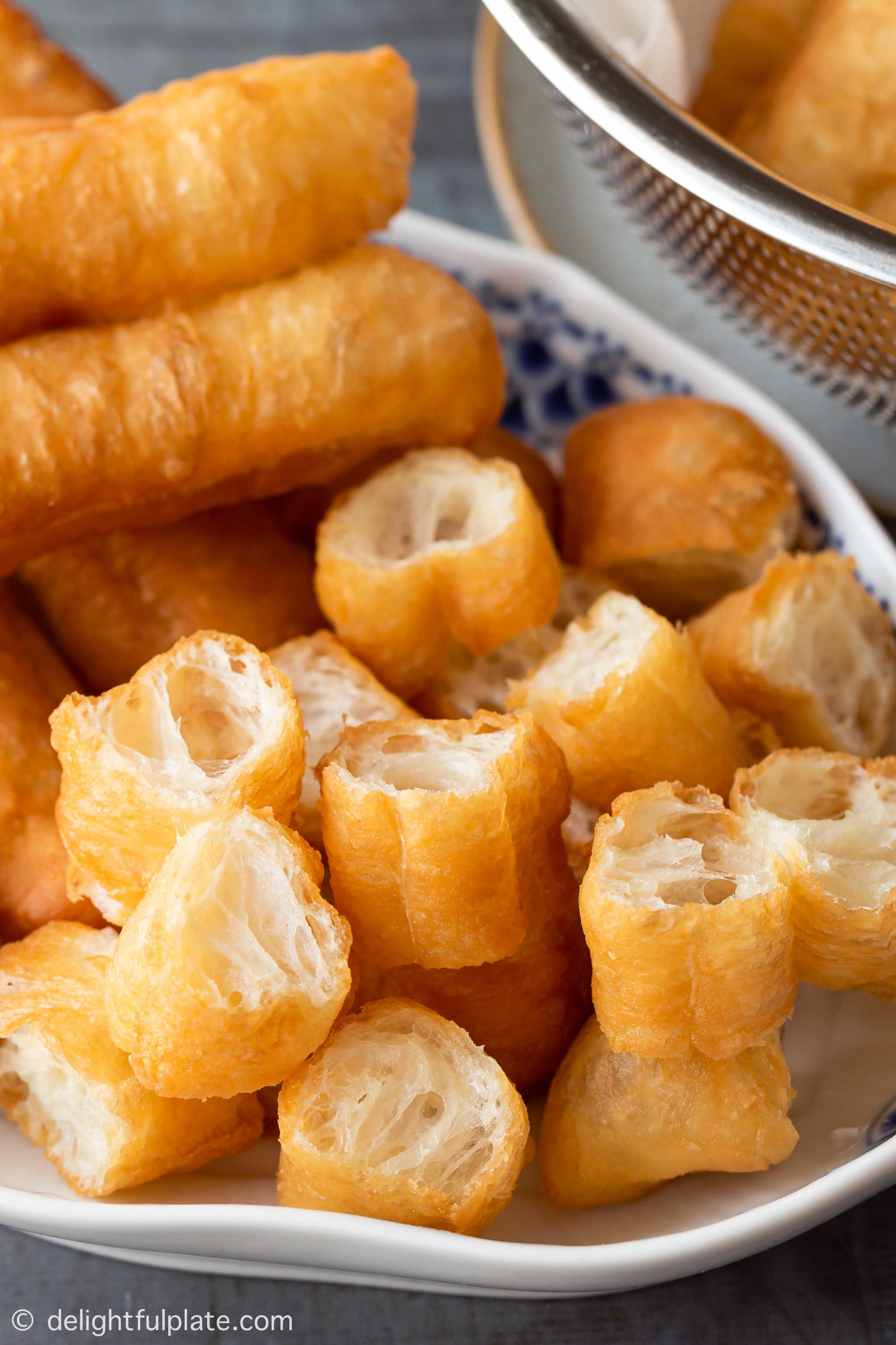 pieces of Chinese fried dough sticks (crullers) on a serving plate.