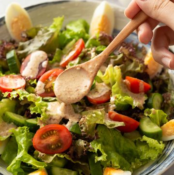 drizzle sesame dressing over salad
