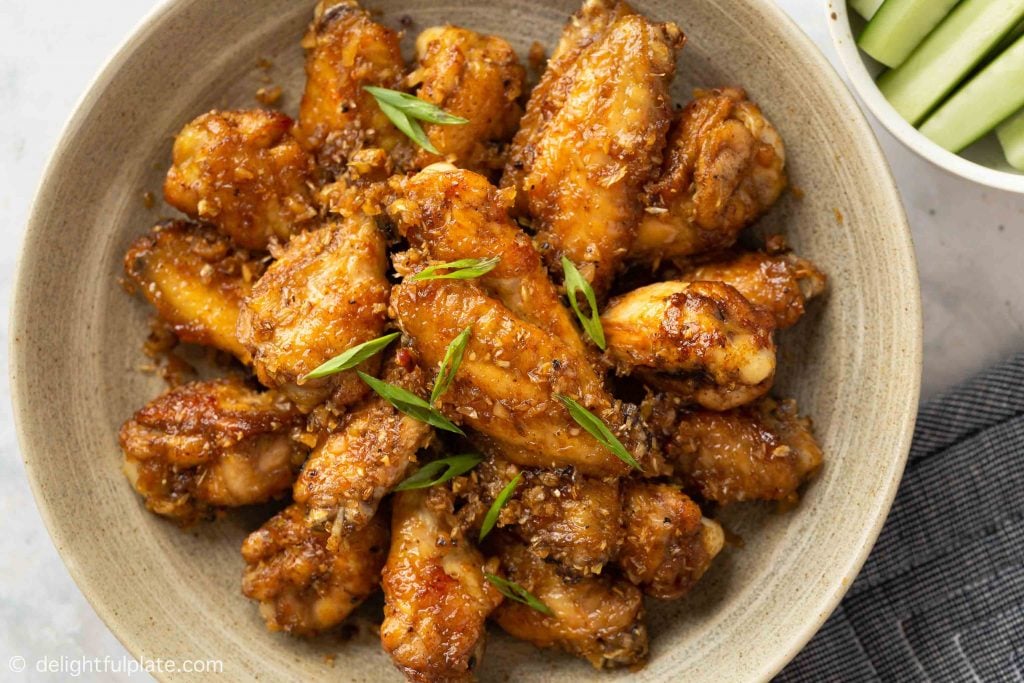 chicken wings with lemongrass sauce on a serving plate