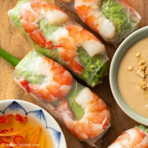 Vietnamese fresh spring rolls on a serving plate with two types of sauces