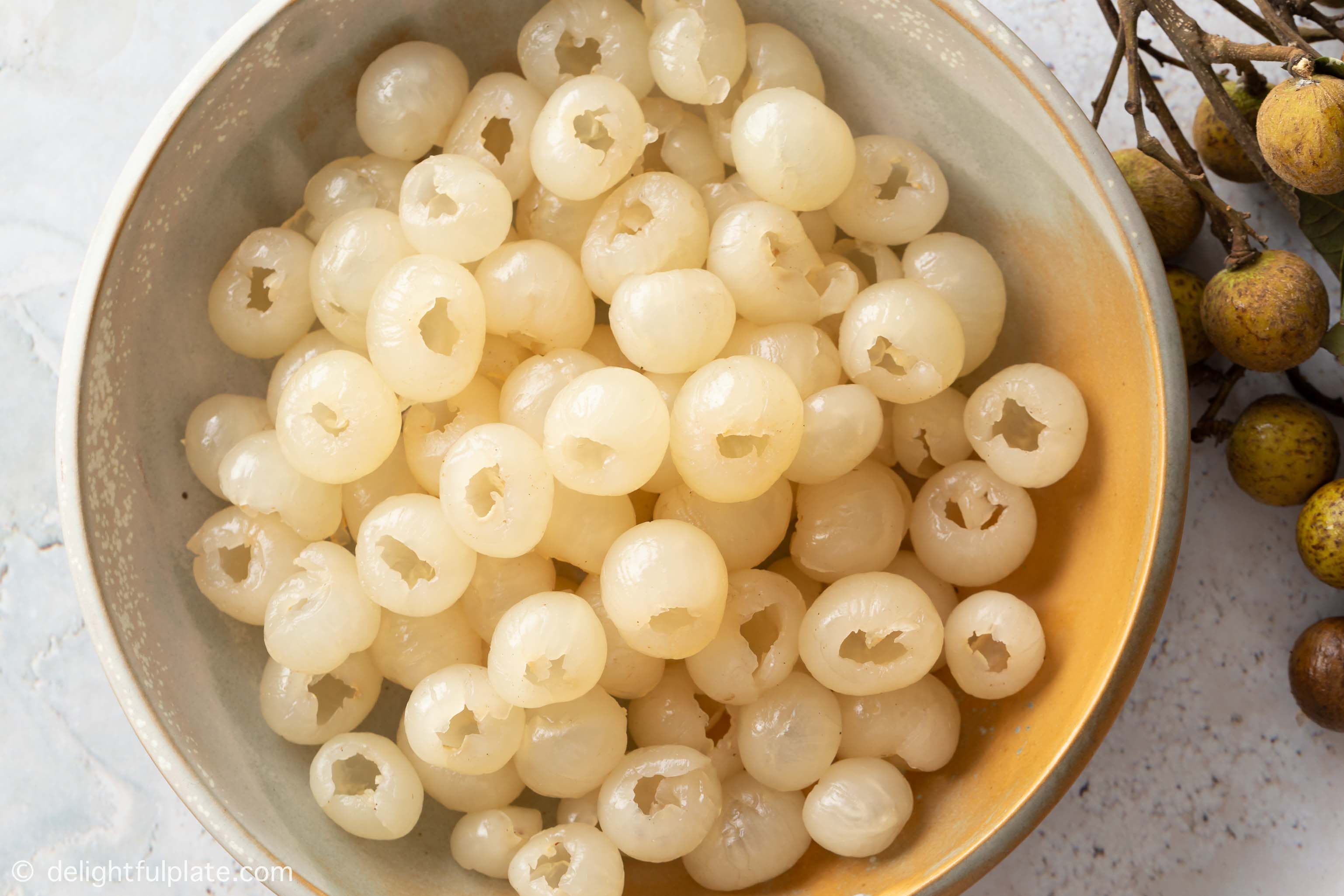 a plate with flesh of longan fruits