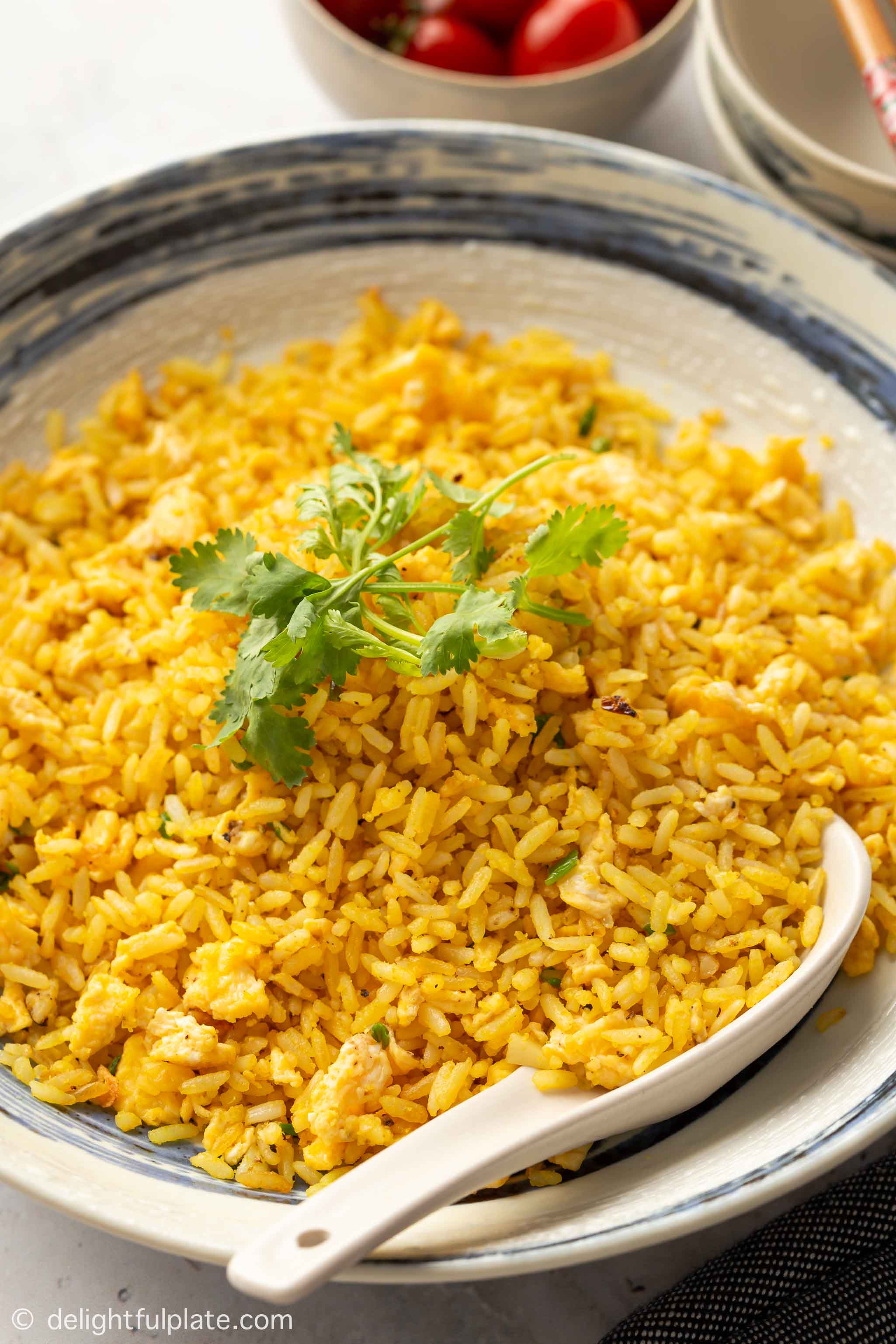 a bowl with salted egg yolk fried rice