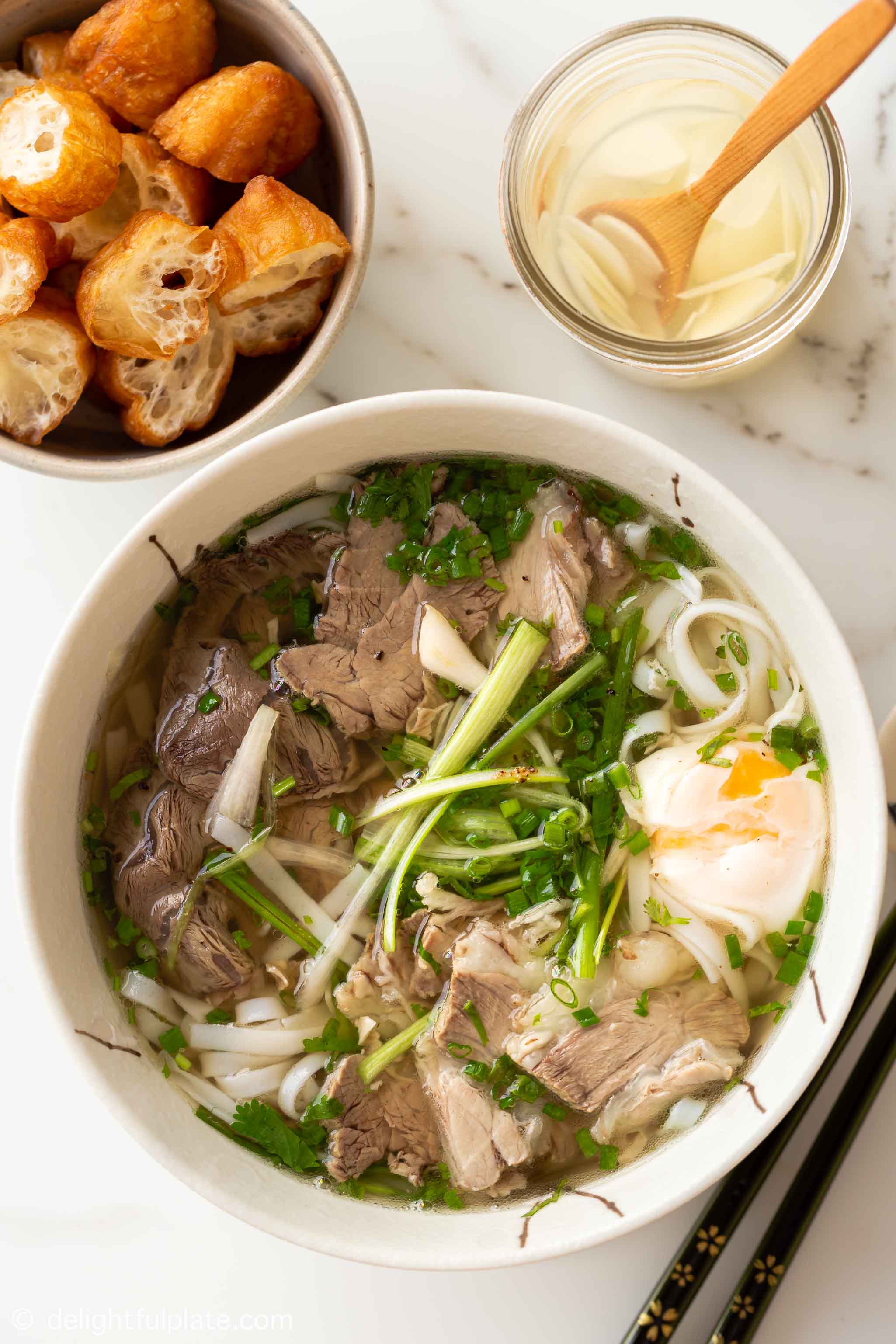 a bowl of Vietnamese beef pho noodle soup