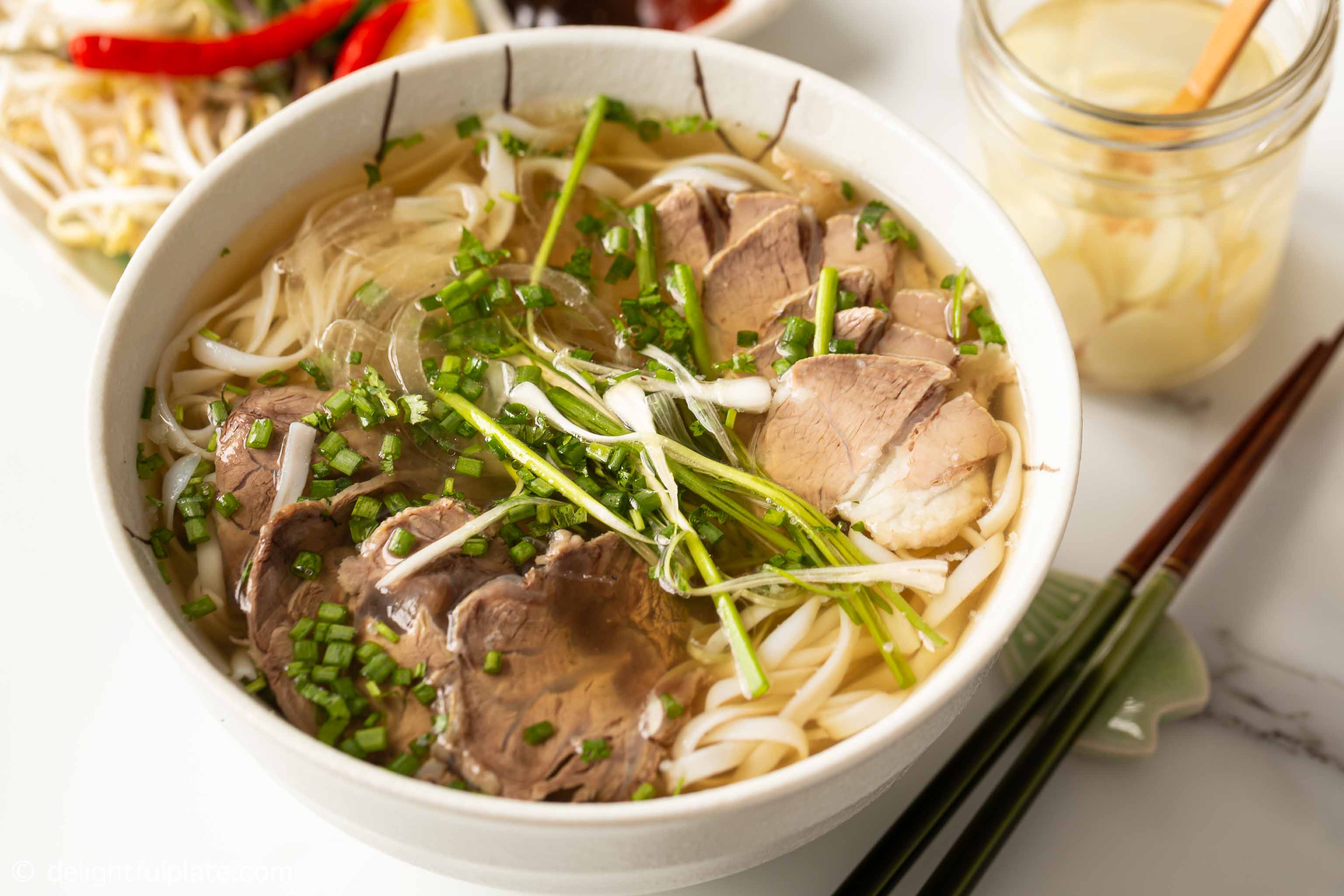  a bowl of beef pho noodle soup