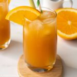 a glass of ginger orange tea