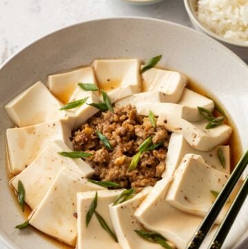 a plate of steamed tofu with ground pork