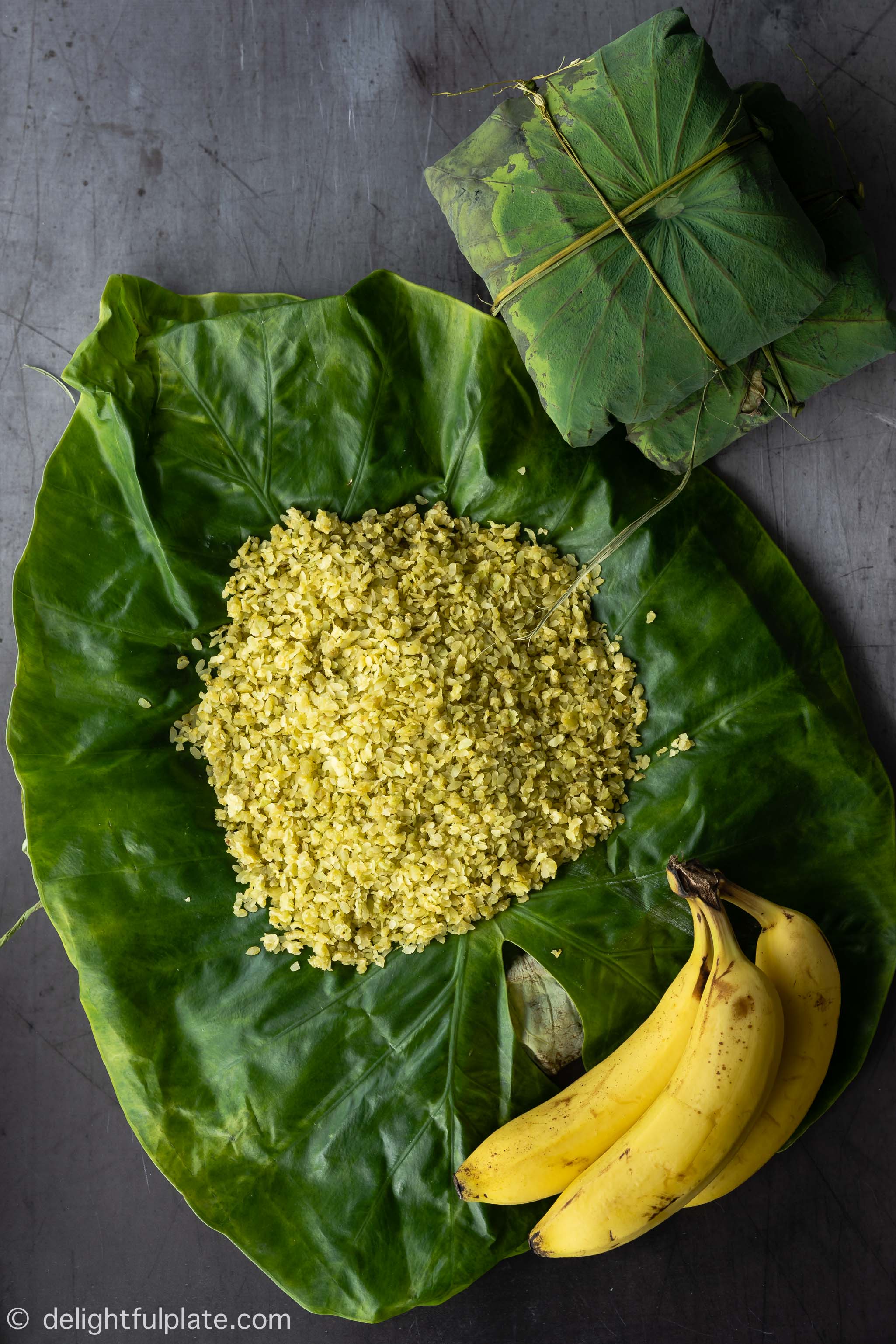a small pile of Vietnamese young green rice on top of lotus leaf